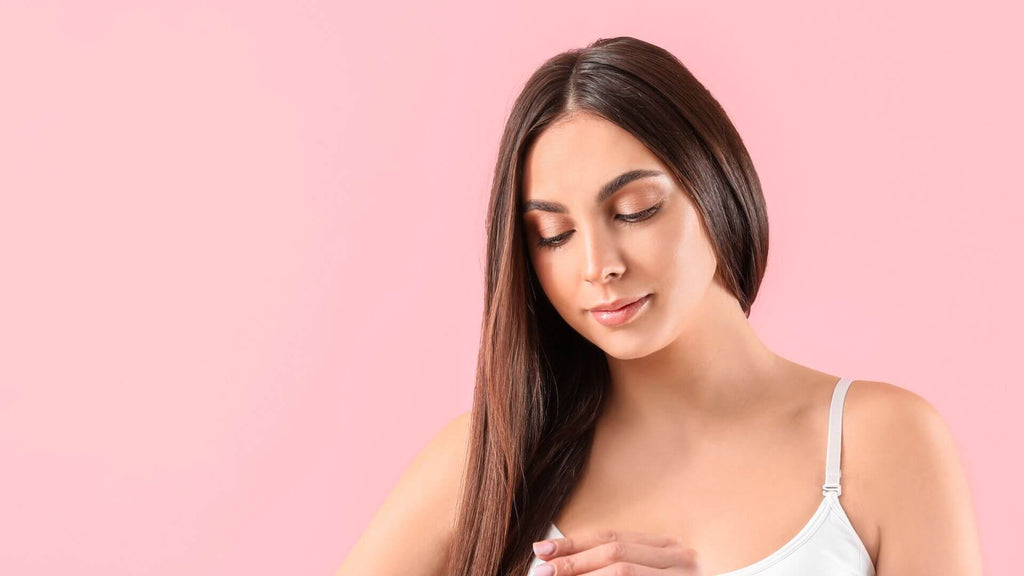 brunette hair woman pink background