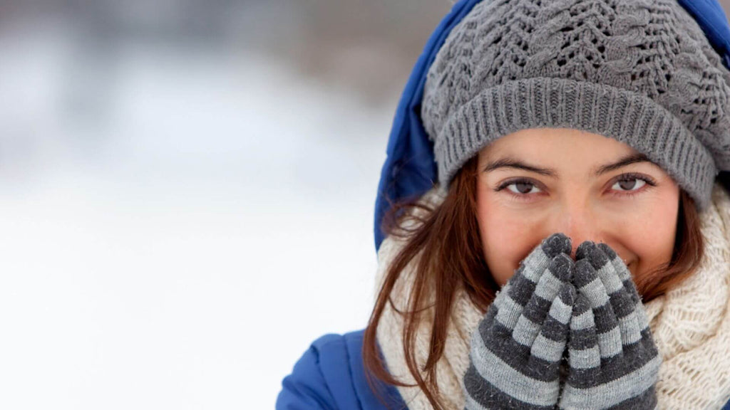 woman wearing hat and gloves holiday