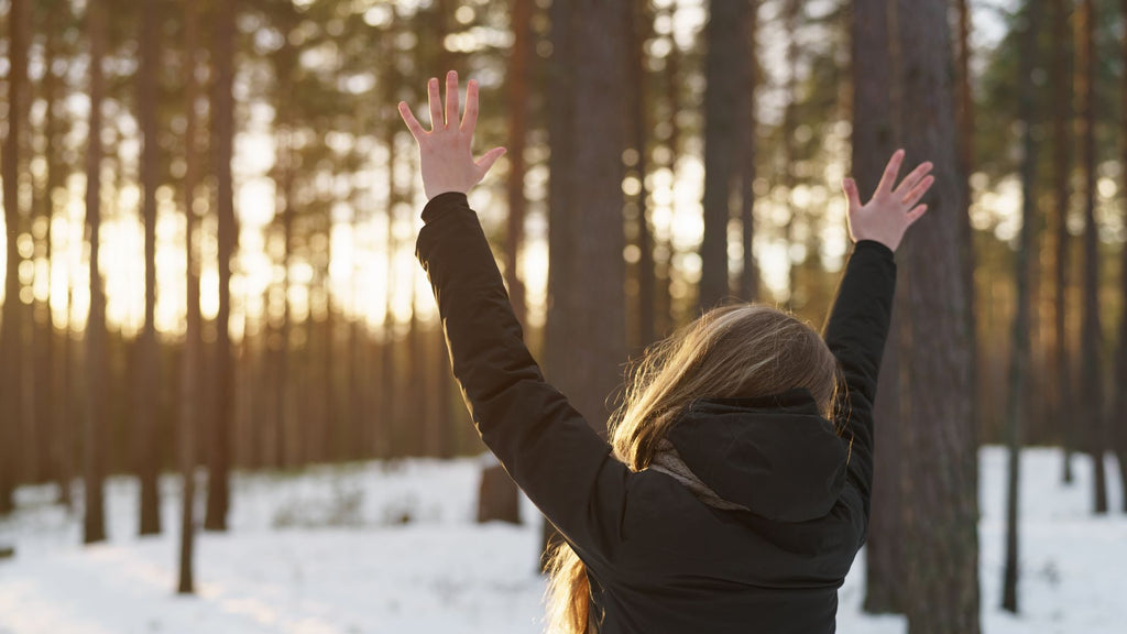 woman with brunette hair in snow