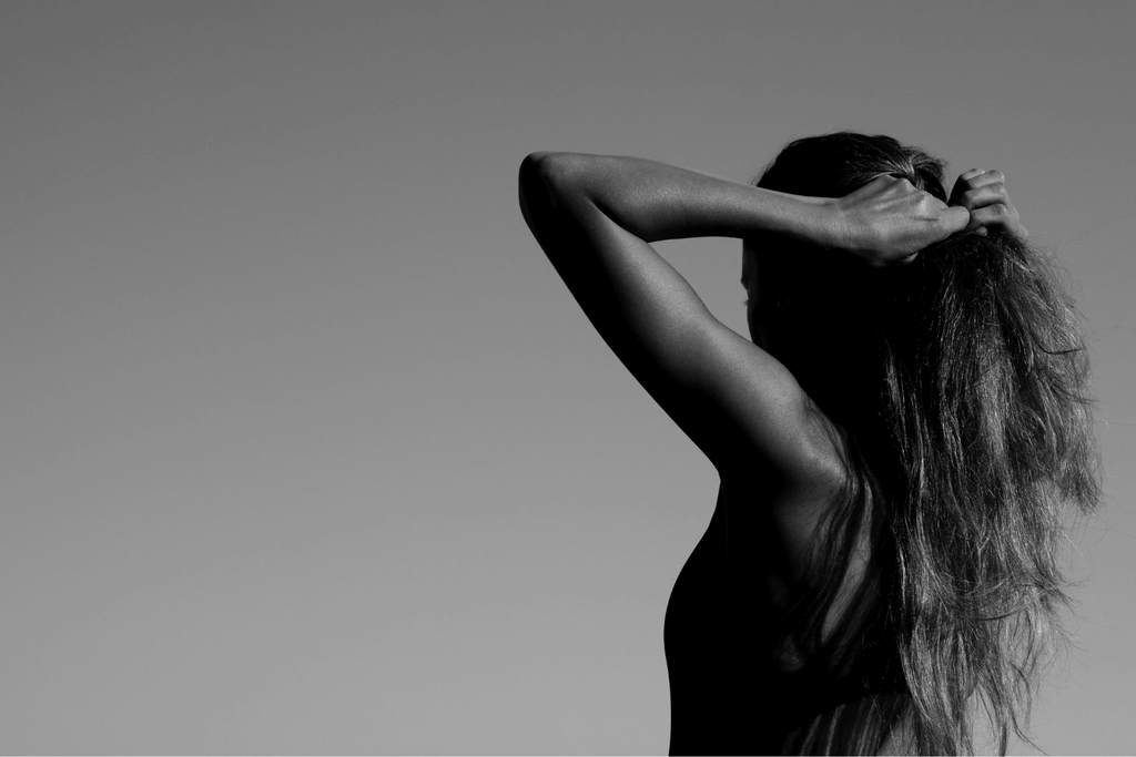 black and white image hands in hair