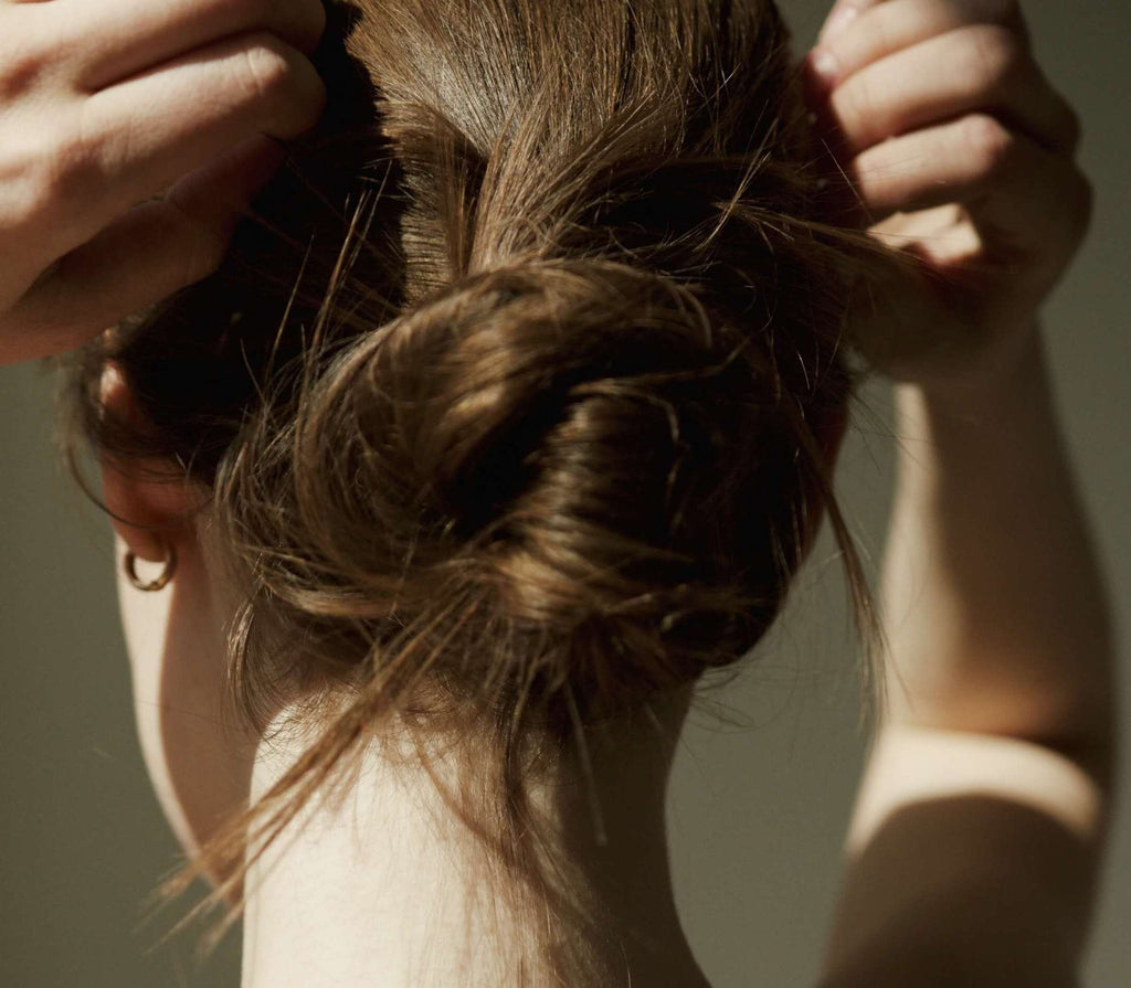 brunette woman with hair up