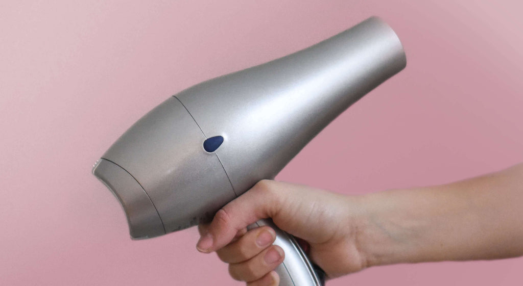 hair dryer pink background