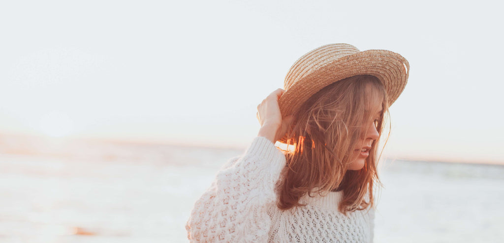 woman hair beach with hat