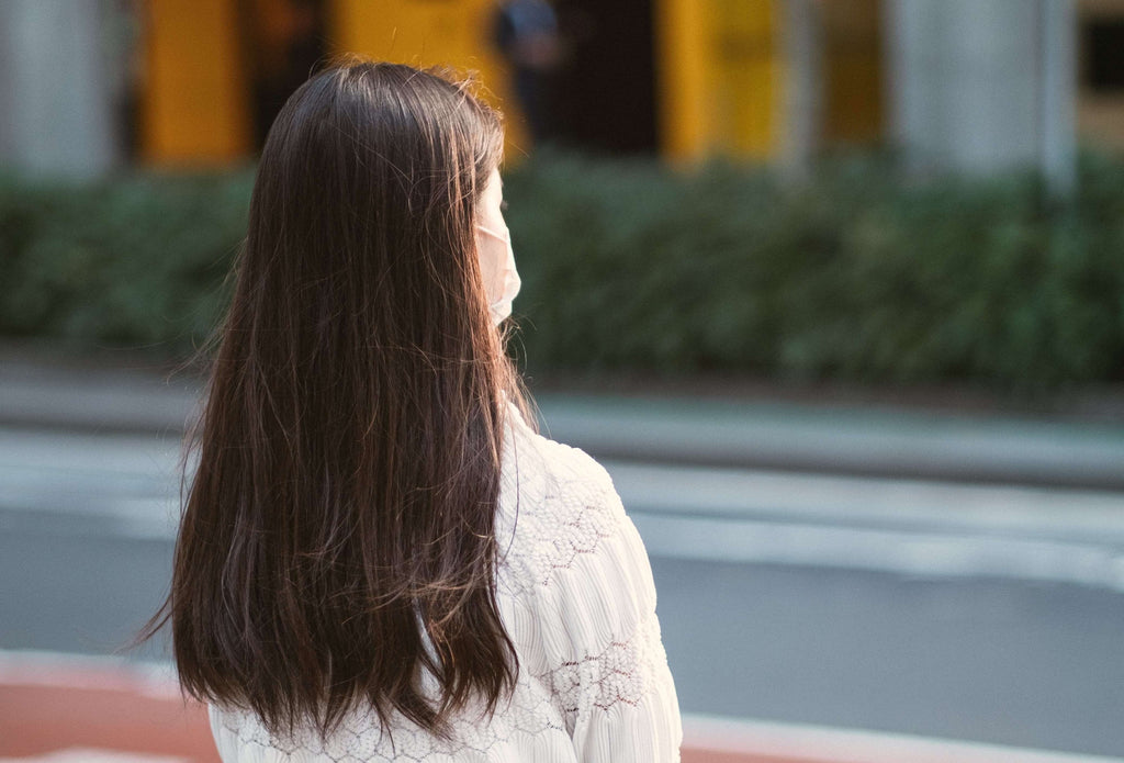 woman with brunette hair back turned