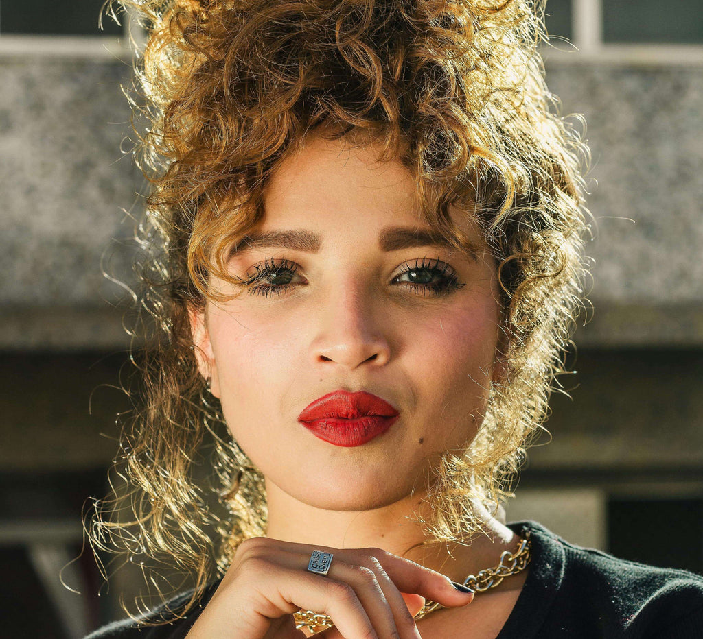 woman with curly hair up