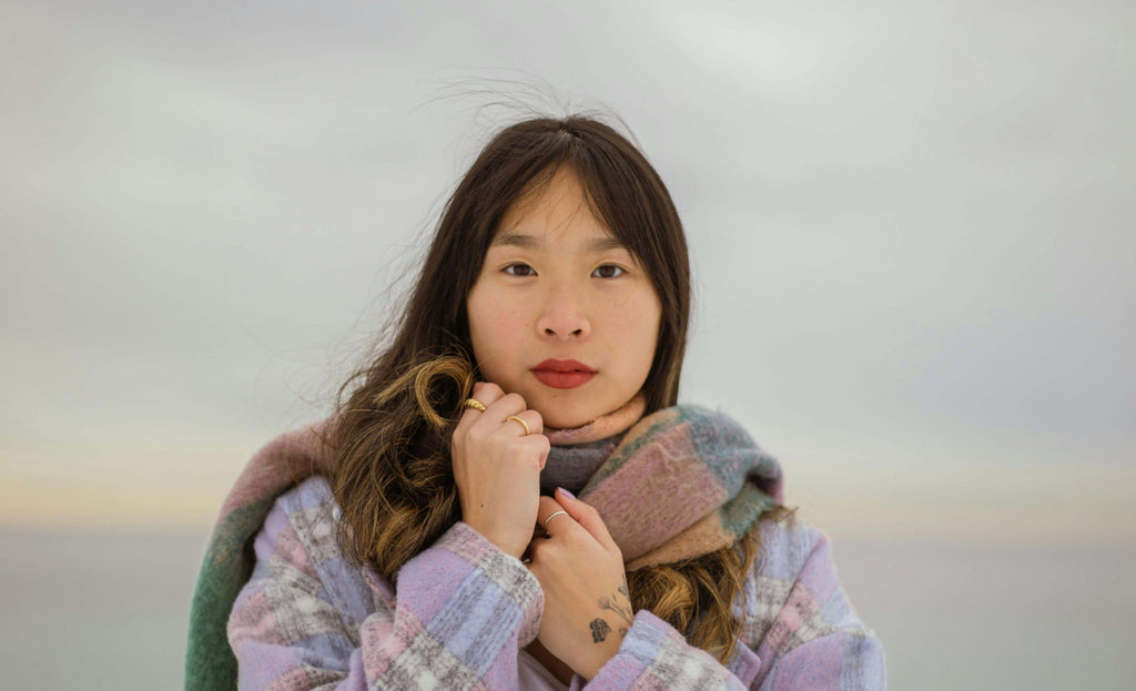 woman holding scarf