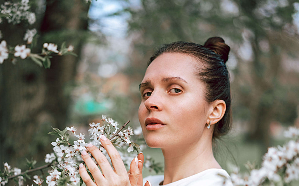 woman with thin hair up in bun