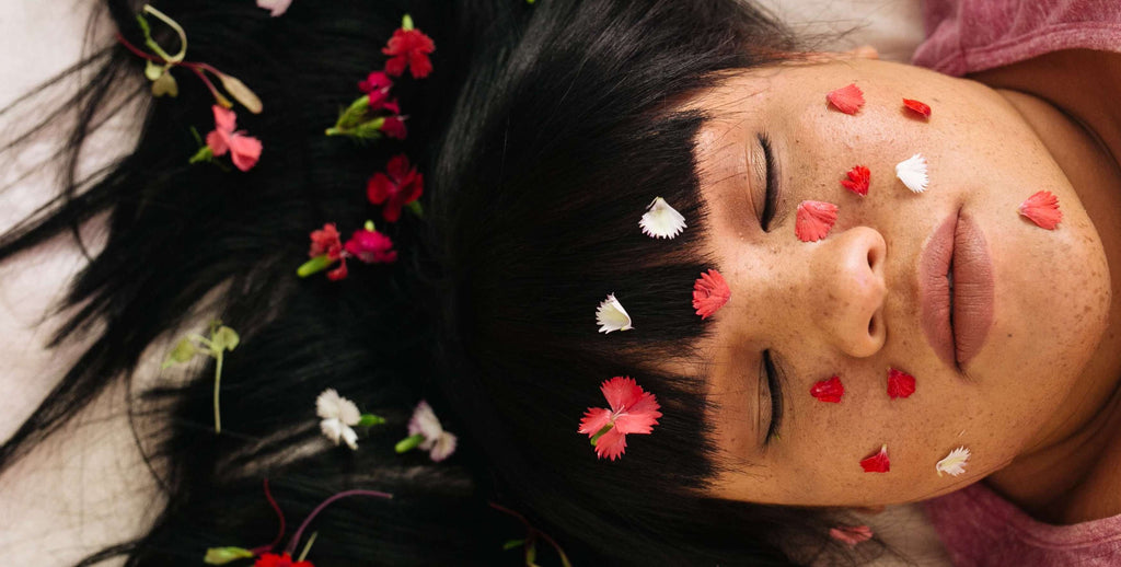 woman with brunette hair flowers in hair