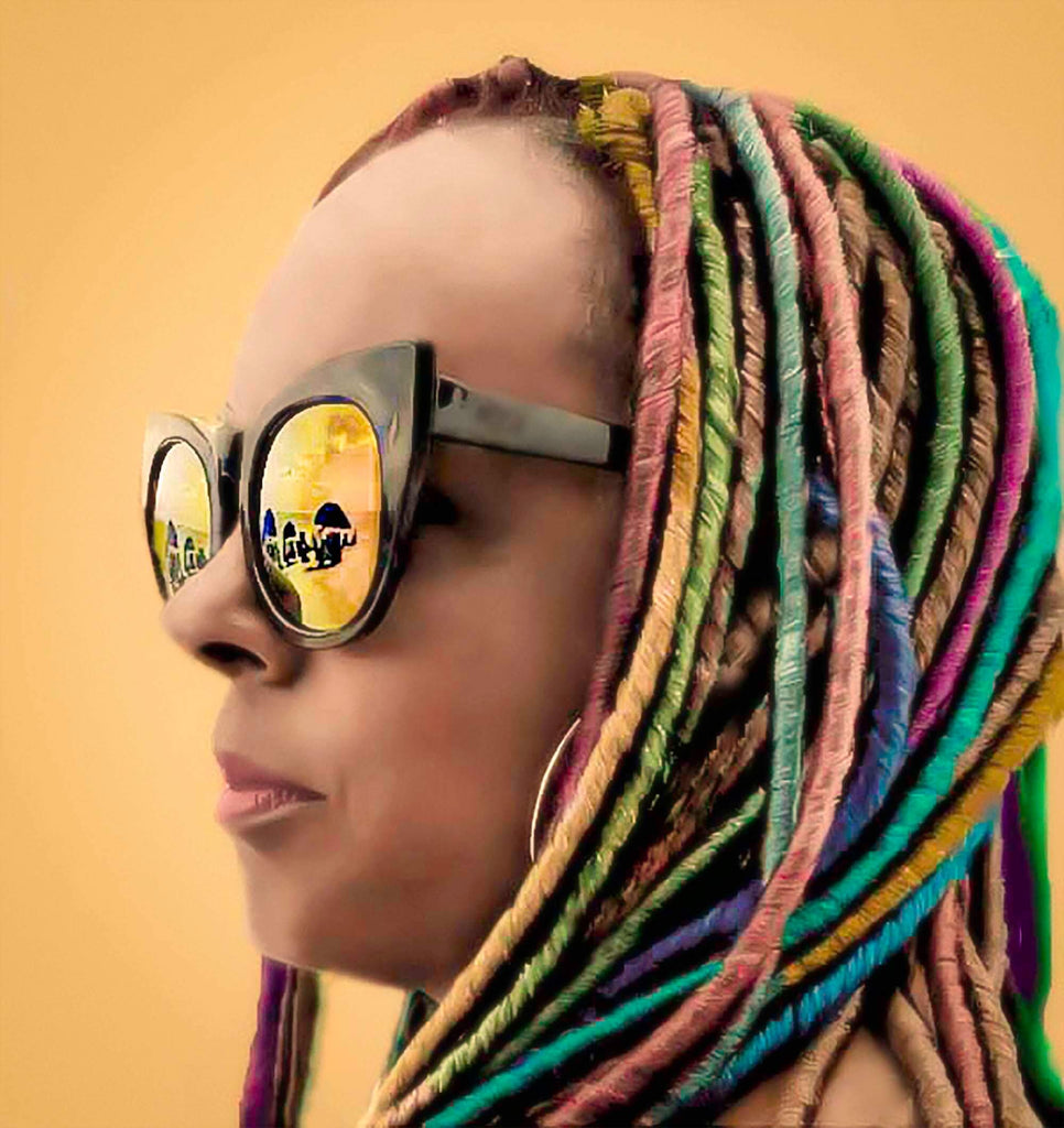 woman colorful braids and sunglasses