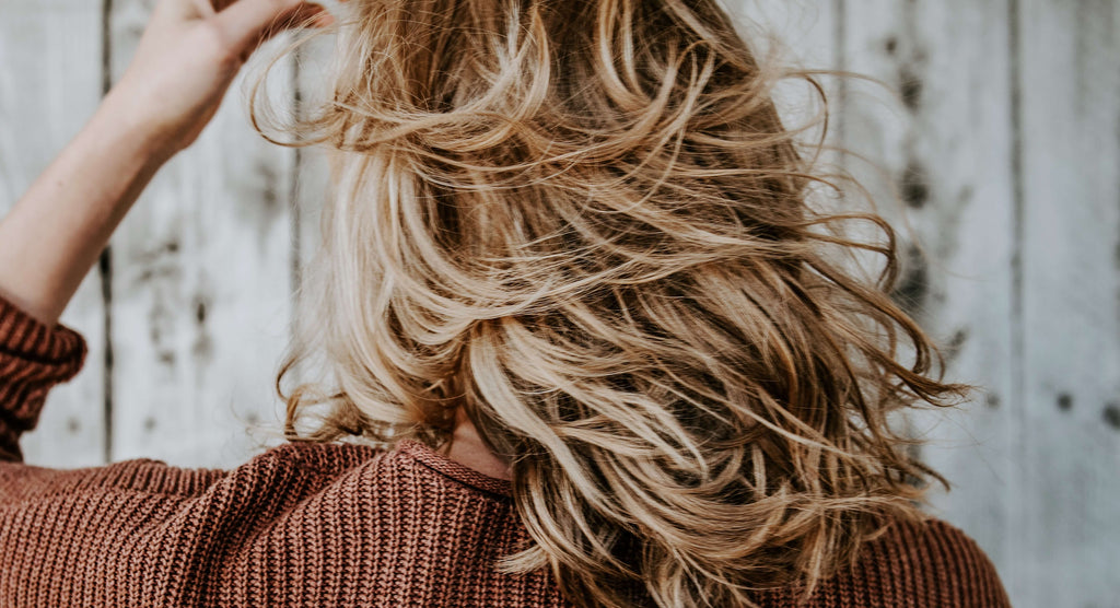 short blonde curly hair woman