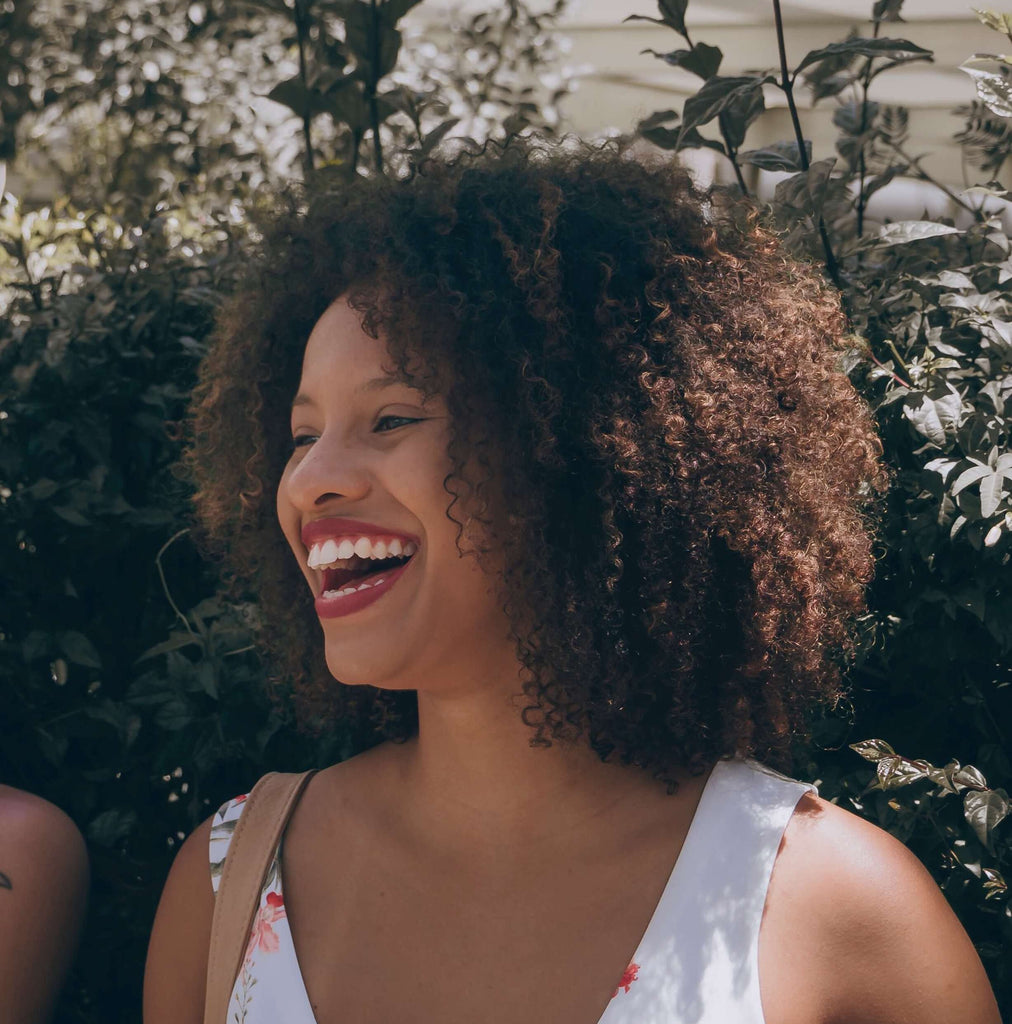 curly kinky hair smiling woman