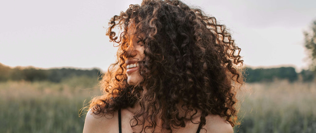 curly hair brunette bob